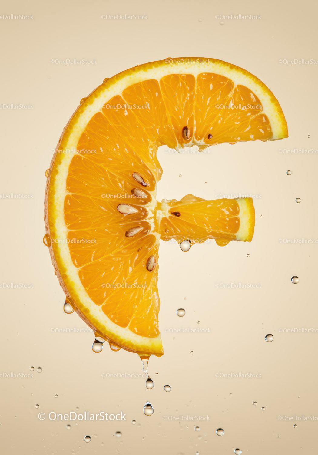 Fresh orange slice dripping water on soft background