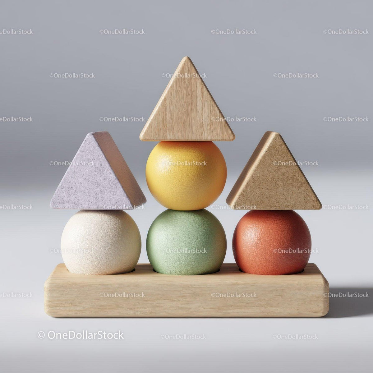 Stack of colorful wooden geometric blocks with spheres and triangles on wooden base