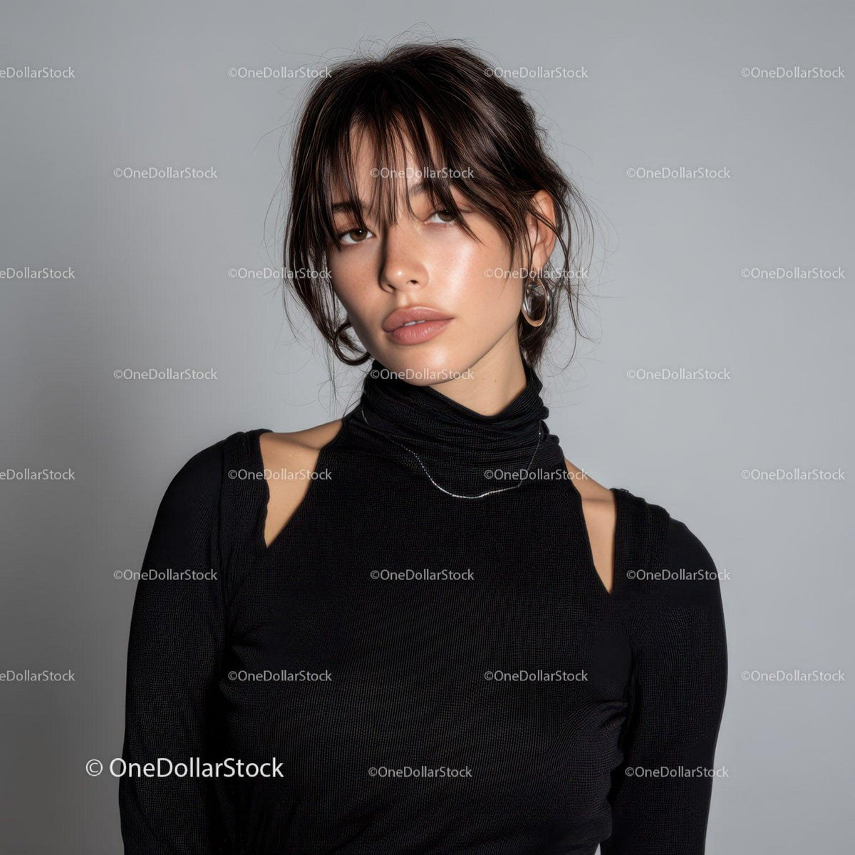 Stylish Young Woman with Short Hair and Silver Earrings in Fashion Portrait