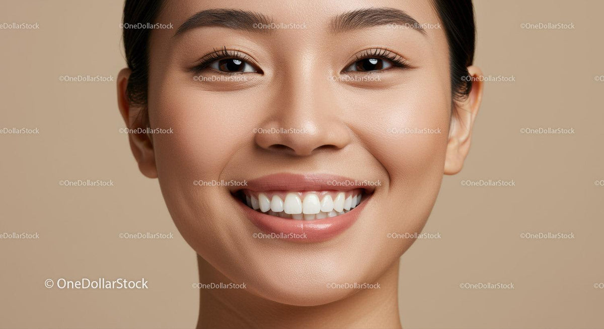 Close up of smiling young woman with flawless skin
