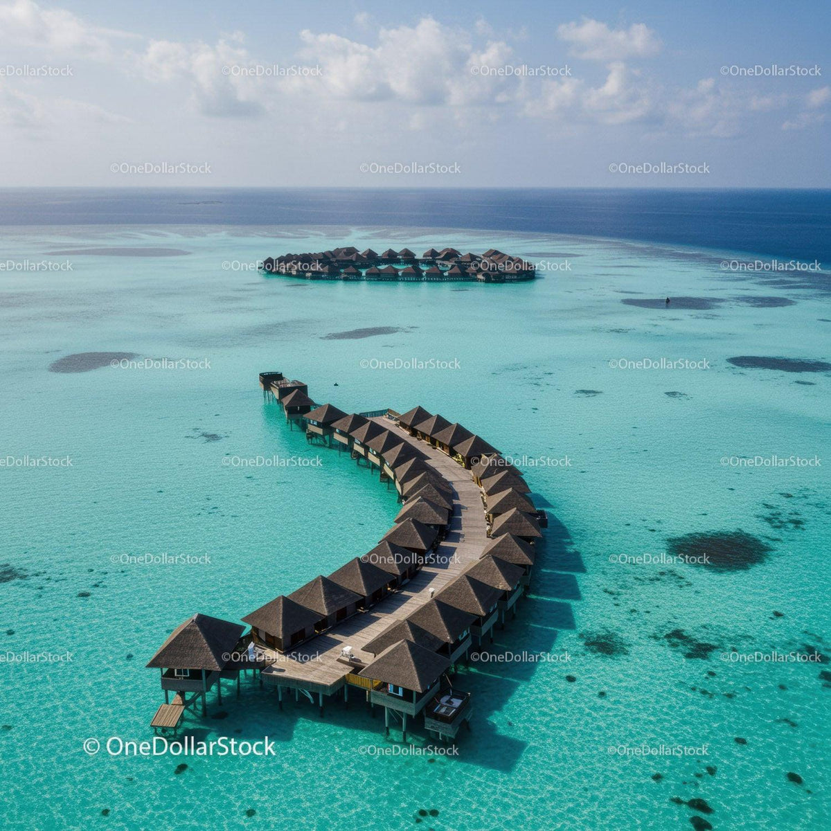 Overwater Bungalows Surrounded by Turquoise Lagoon in Tropical Paradise