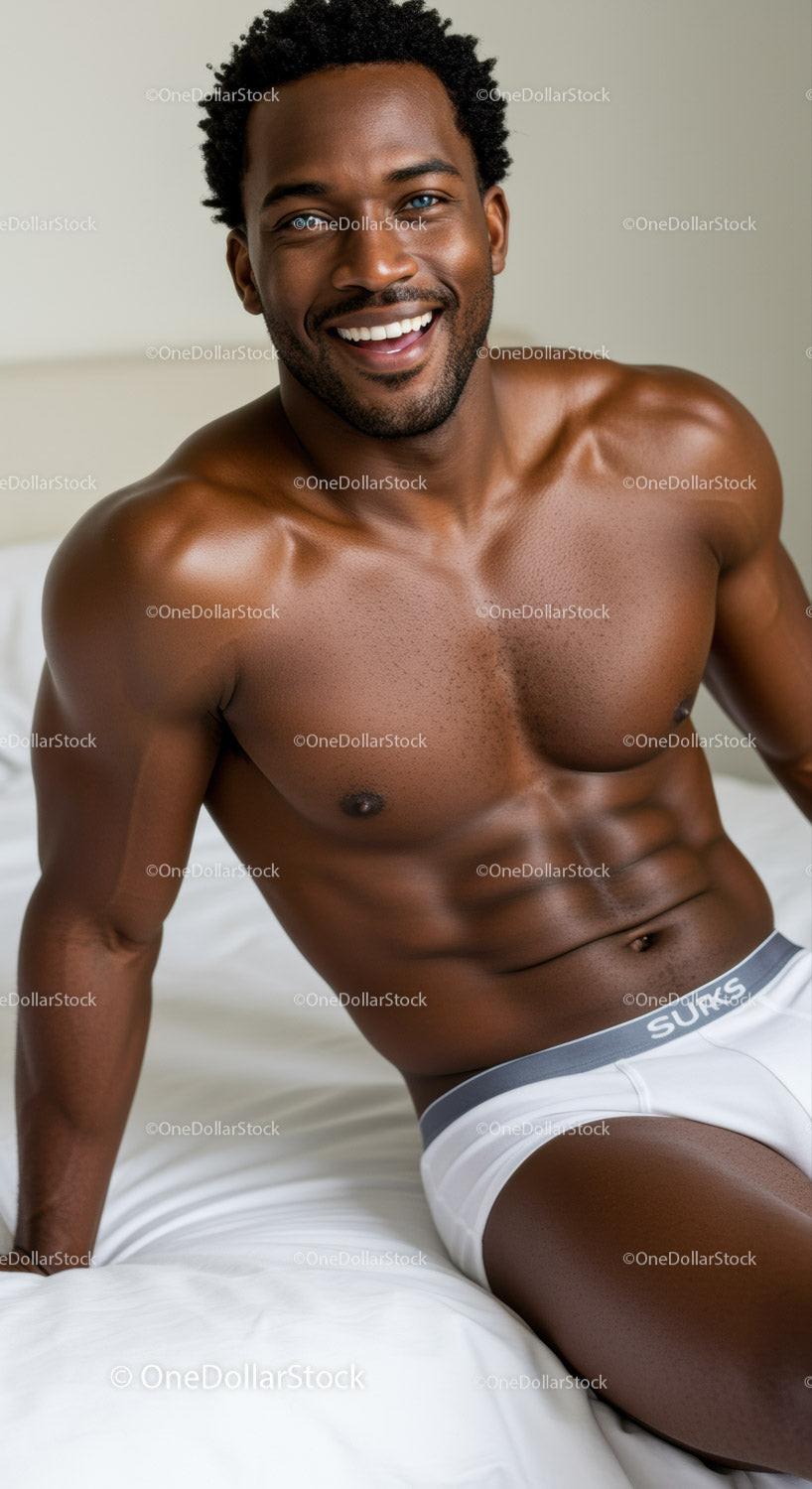 Smiling muscular man relaxing on bed in underwear