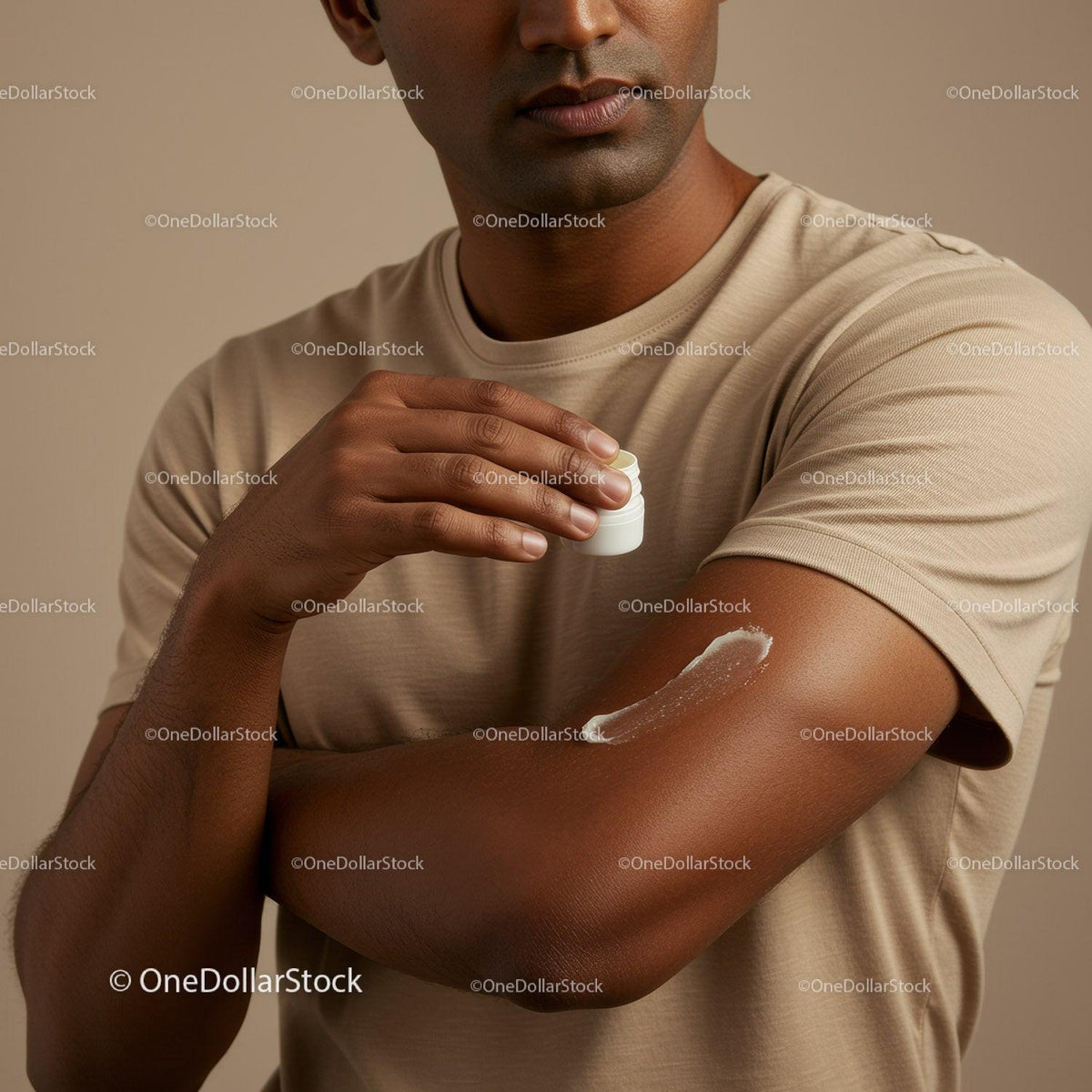 Man Applying Lotion on Arm in Close-Up for Skin Moisturization