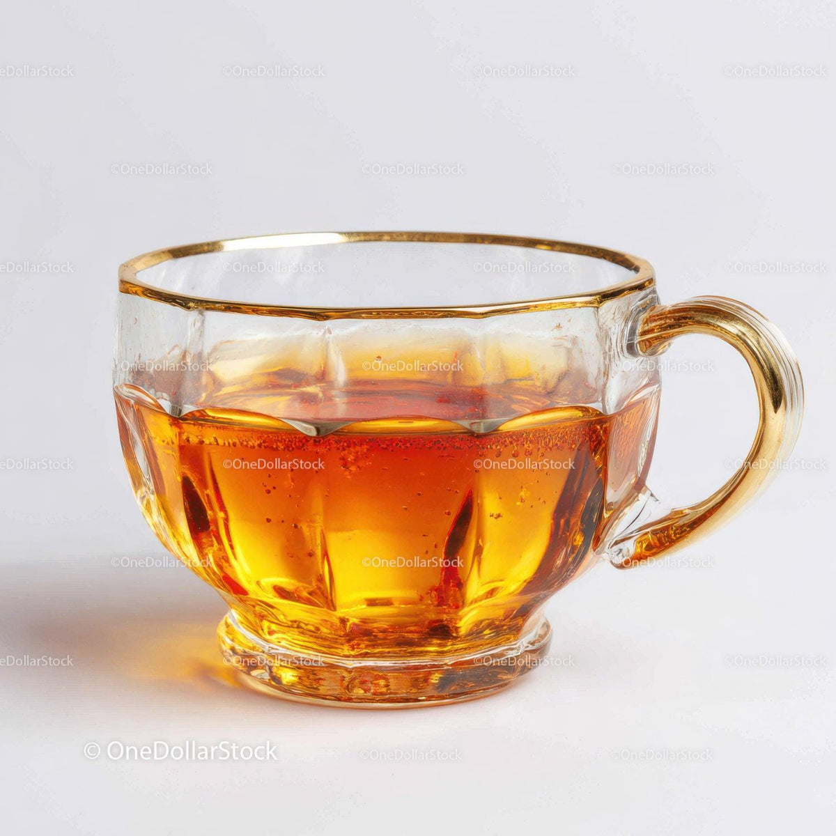 Elegant Clear Glass Tea Cup with Amber Liquid for Refreshing Drinks Stock Photo Bundle preview 5
