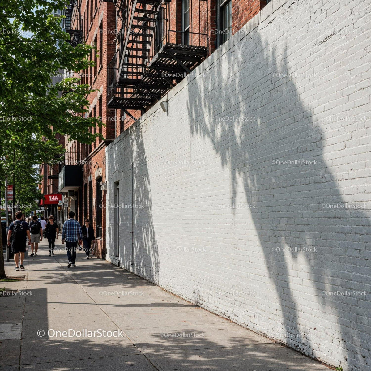 Urban Street Scene with Pedestrians and Shadows on Brick Wall JPG Mockup Image preview