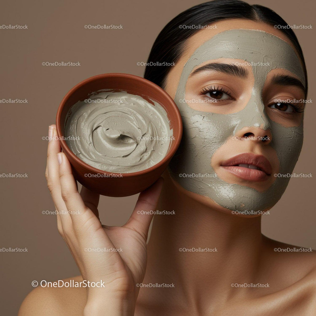 Woman with clay facial mask and bowl of facial cream in beauty spa
