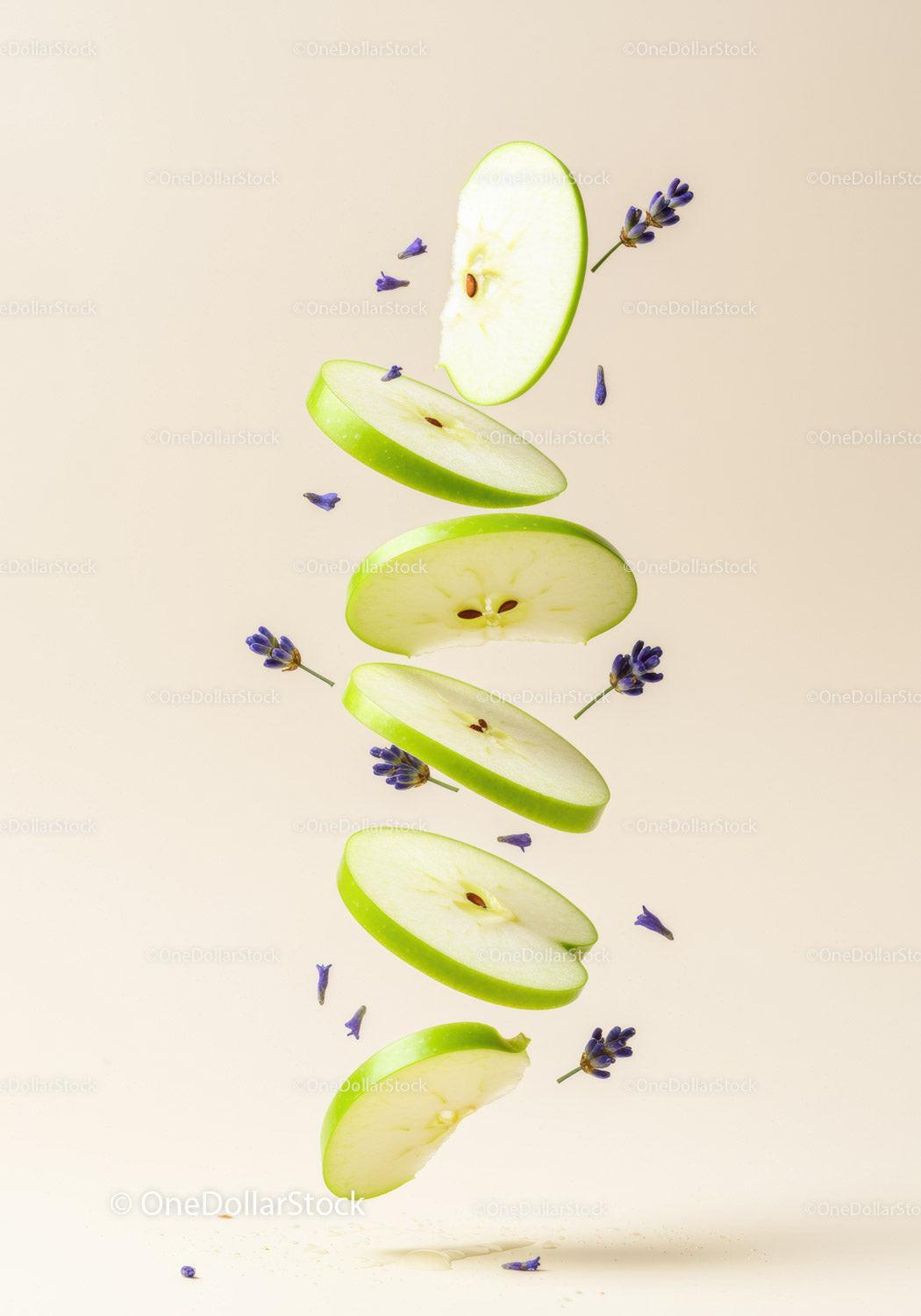 Floating green apple slices with delicate lavender buds