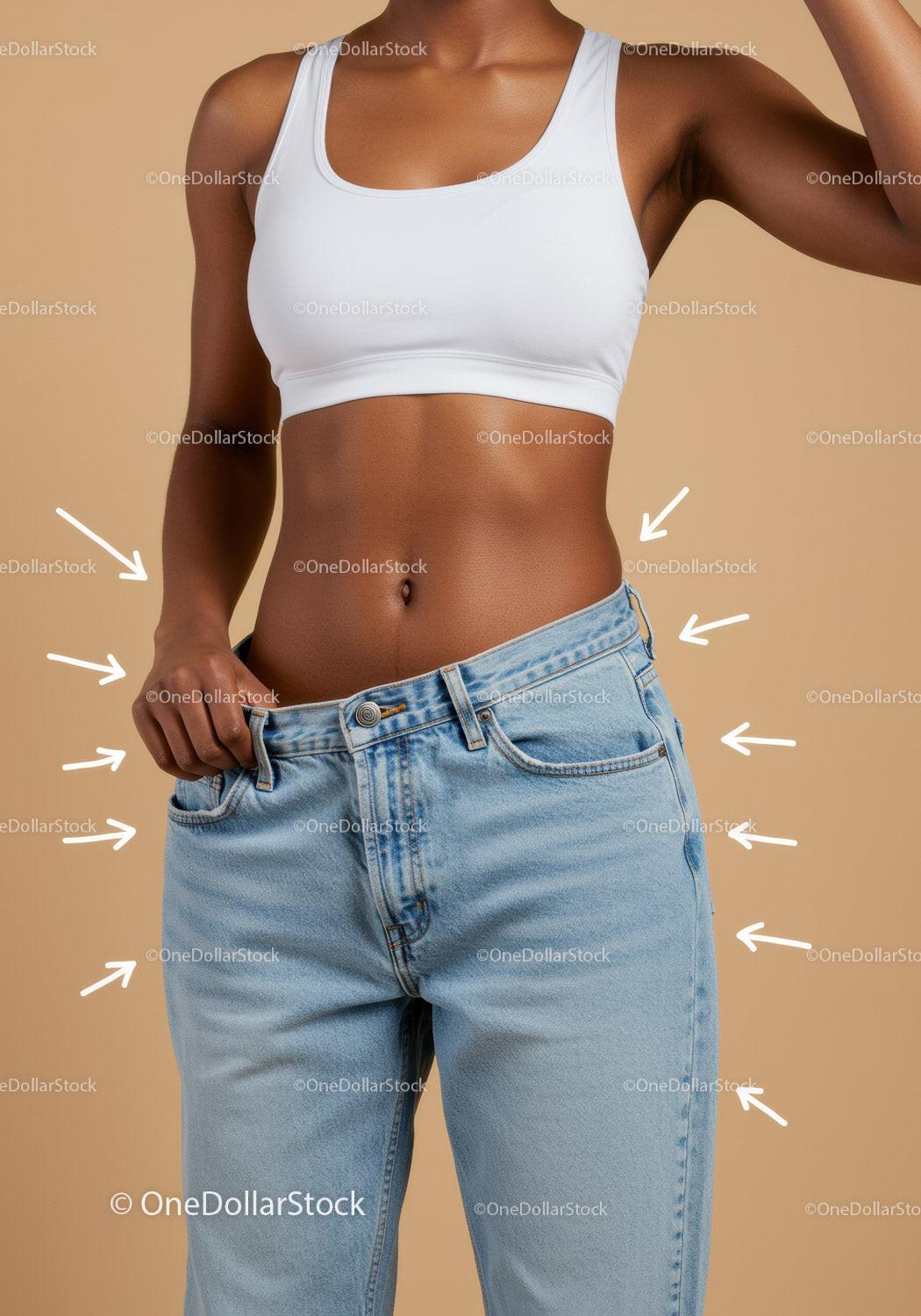 Stylish Woman in Crop Top and Blue Jeans Showing Toned Midsection