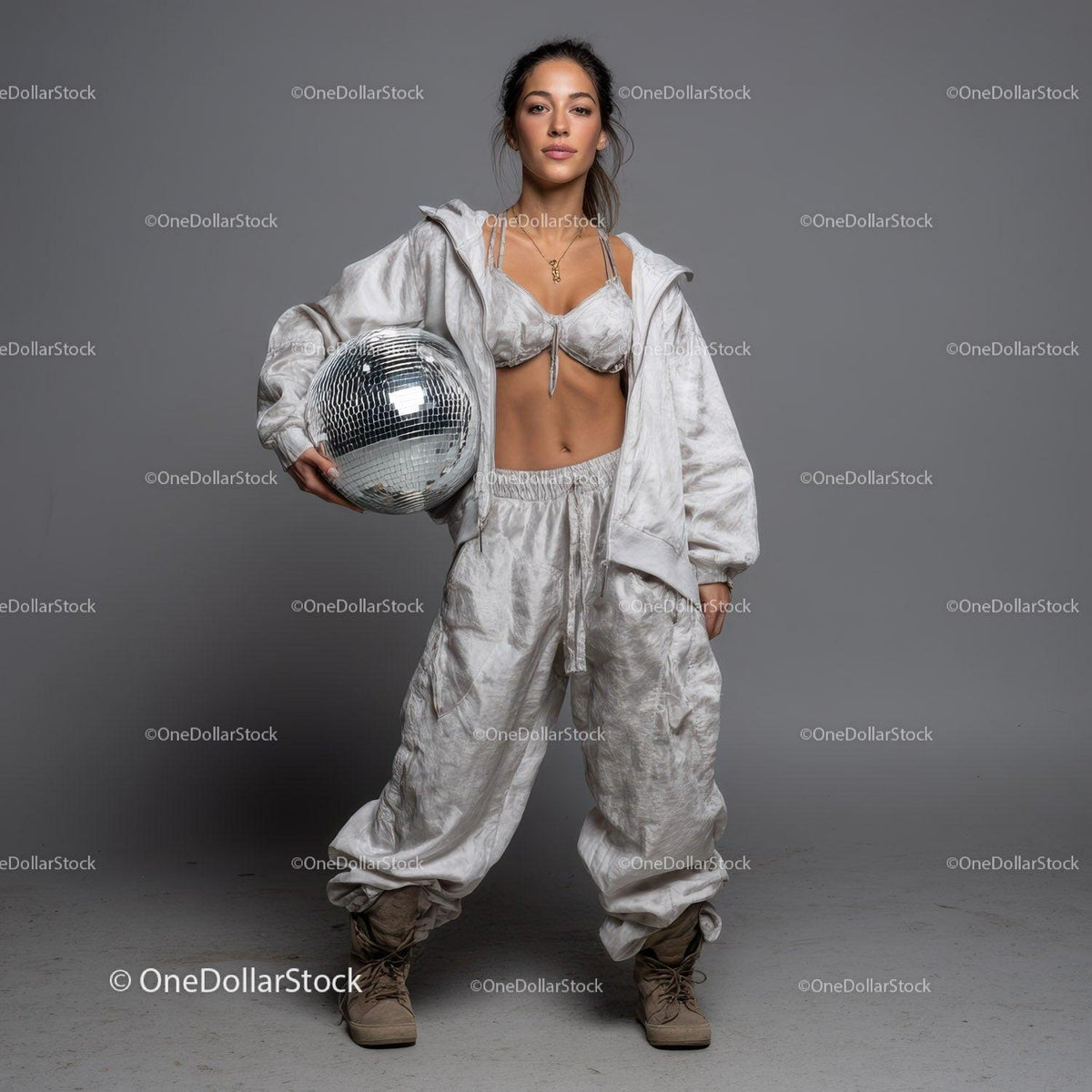 Stylish Woman in Metallic Outfit Holding Disco Ball for Modern Fashion Stock Photo Bundle preview 7