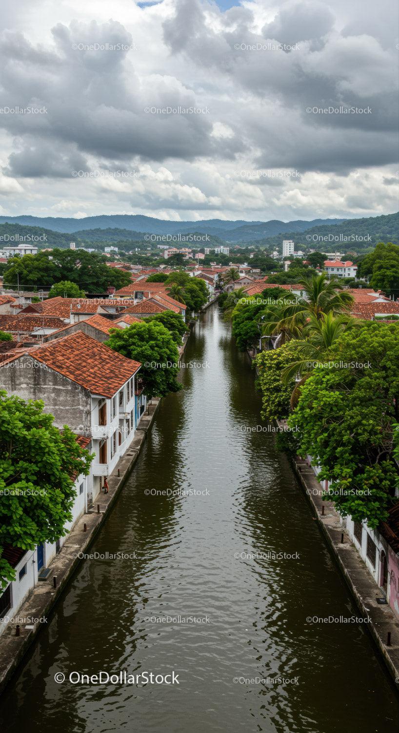 Tropical Town Amid Lush Greenery and Cloudy Sky