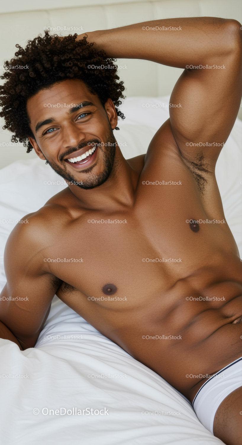 Smiling man relaxing on bed with casual pose