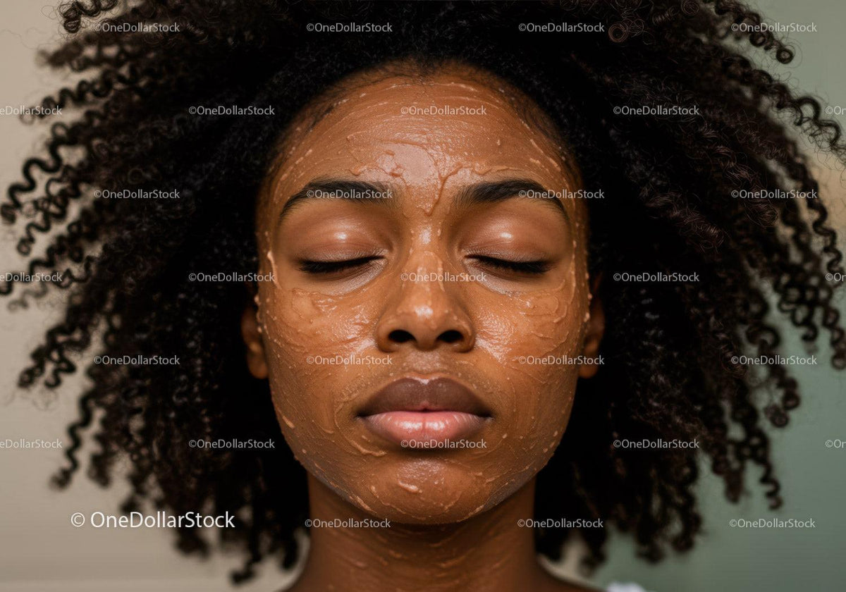 Woman with Curly Hair Applying Facial Mask for Skincare Routine