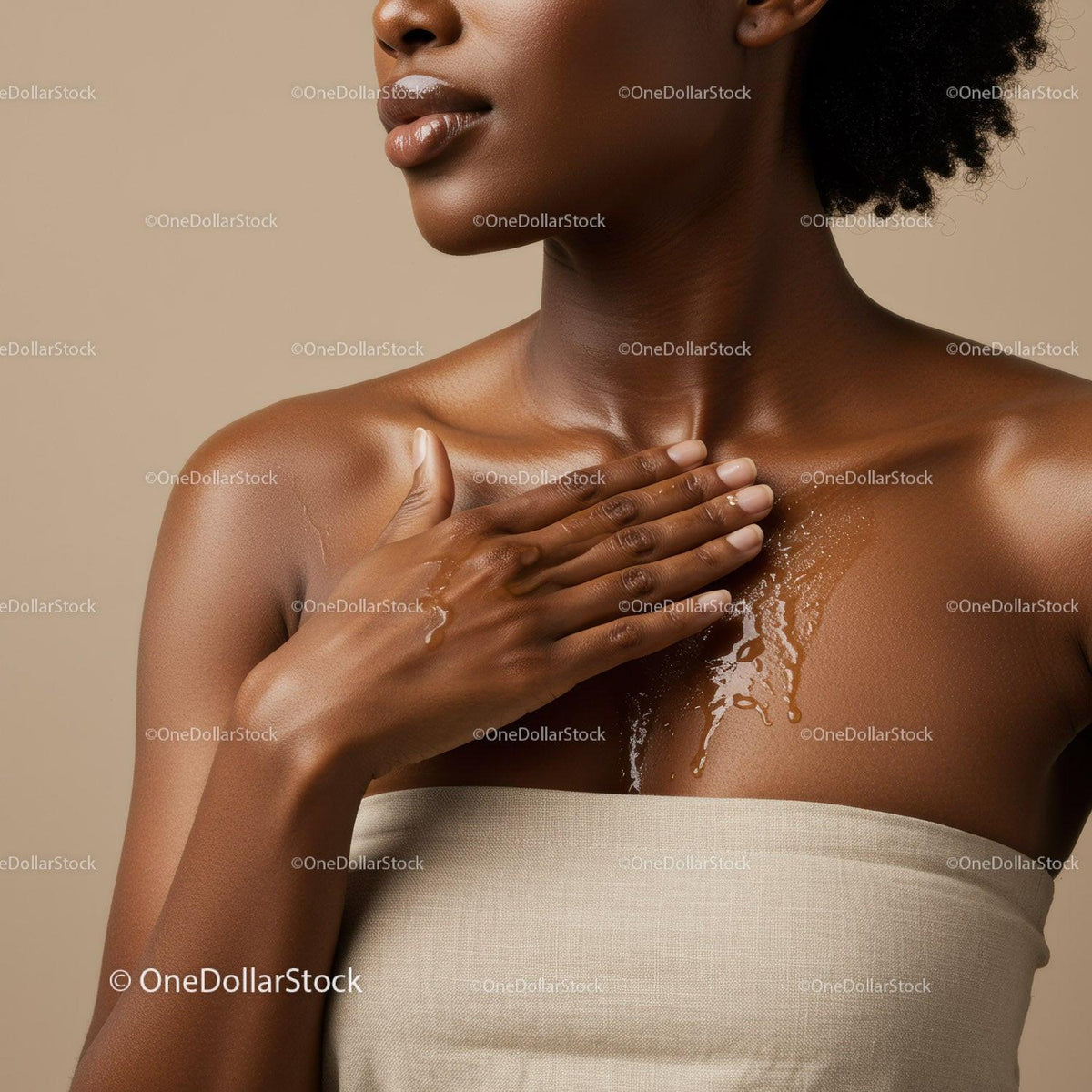 Portrait of a Black Woman Applying Coconut Oil on Her Shoulder