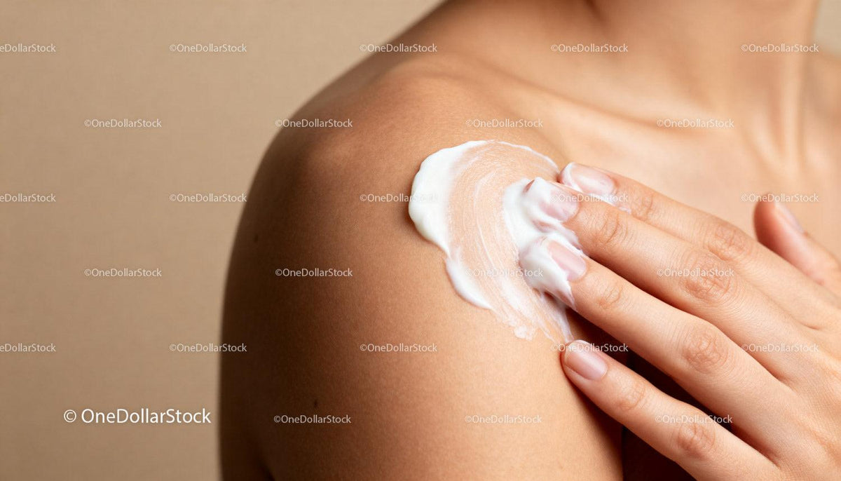 Applying moisturizing cream on smooth shoulder skin