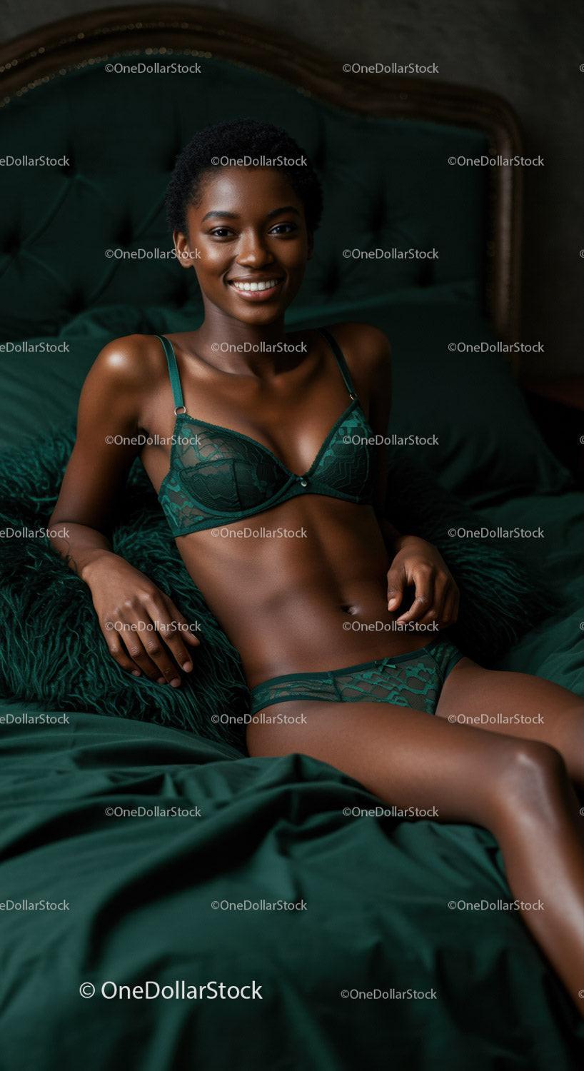 Smiling woman relaxing on bed in green lingerie set