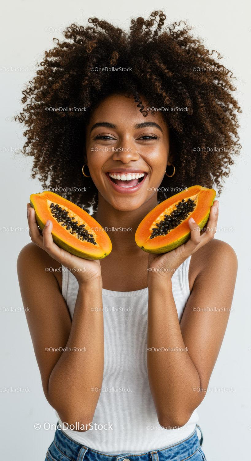 Young Woman with Fresh Papaya Slices Smiling Brightly