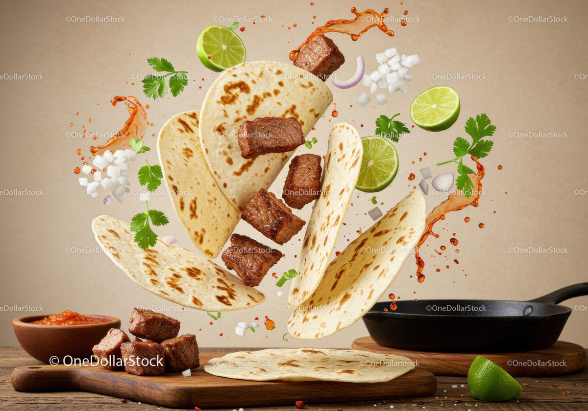 Flying beef taco ingredients with fresh lime and spices