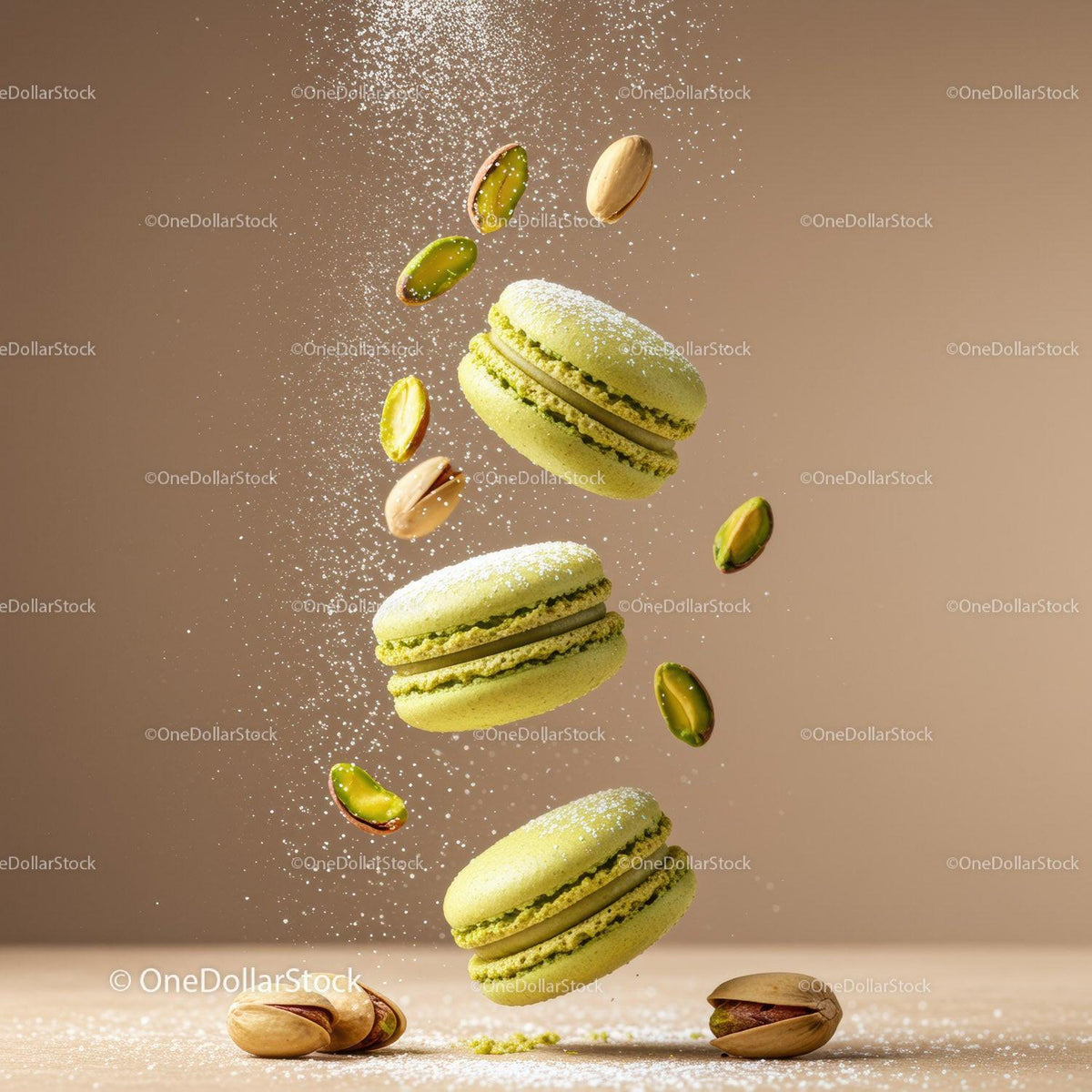 Green pistachio macarons with powdered sugar and nuts