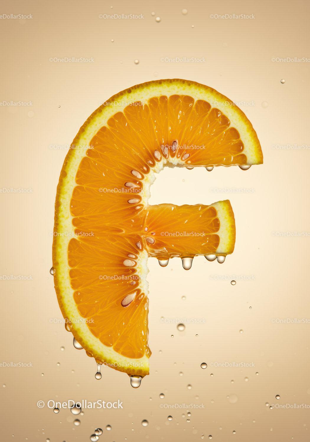 Fresh Orange Slice Shaped Like Euro Symbol with Droplets