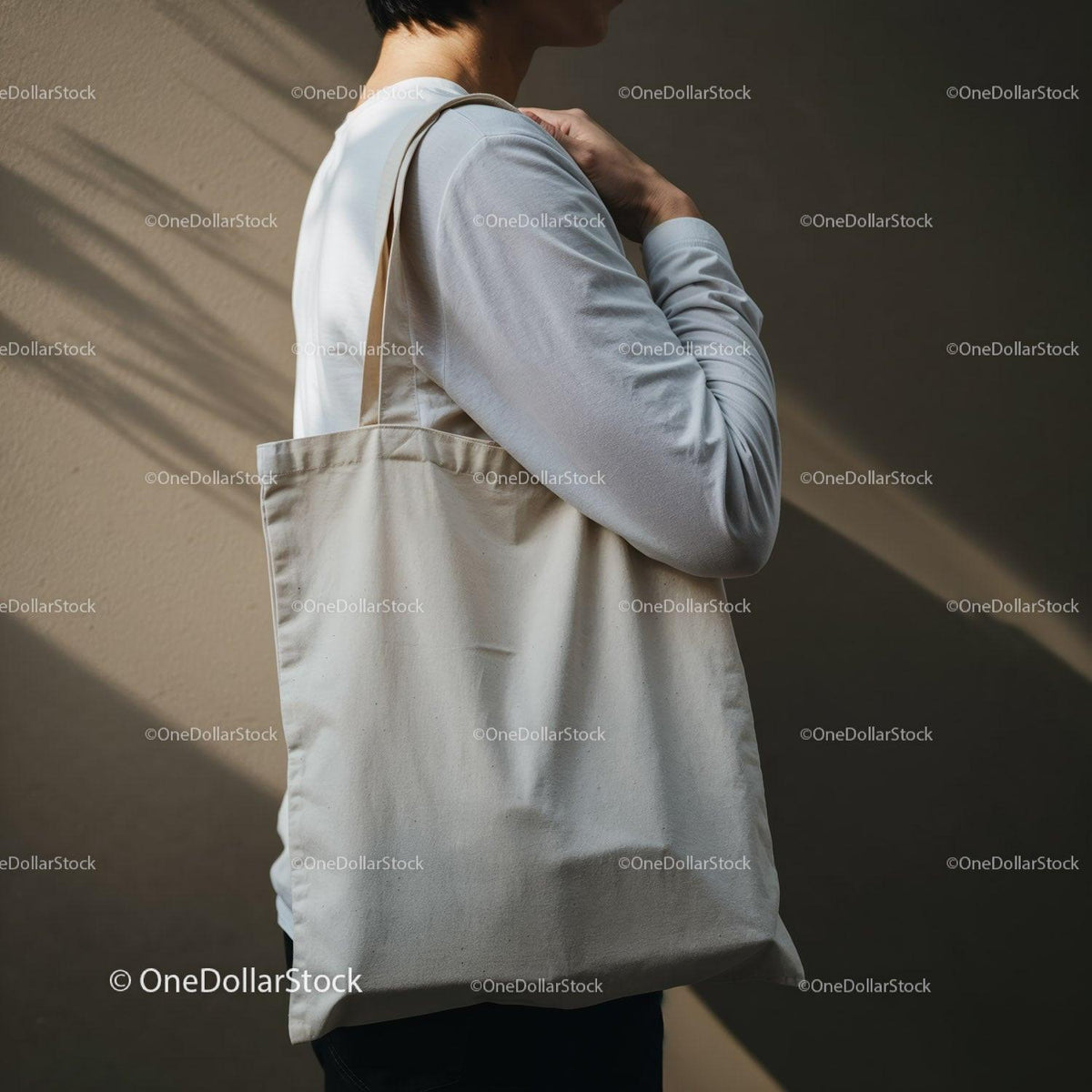 Person Carrying Plain Canvas Tote Bag on Shoulder JPG Mockup Image preview