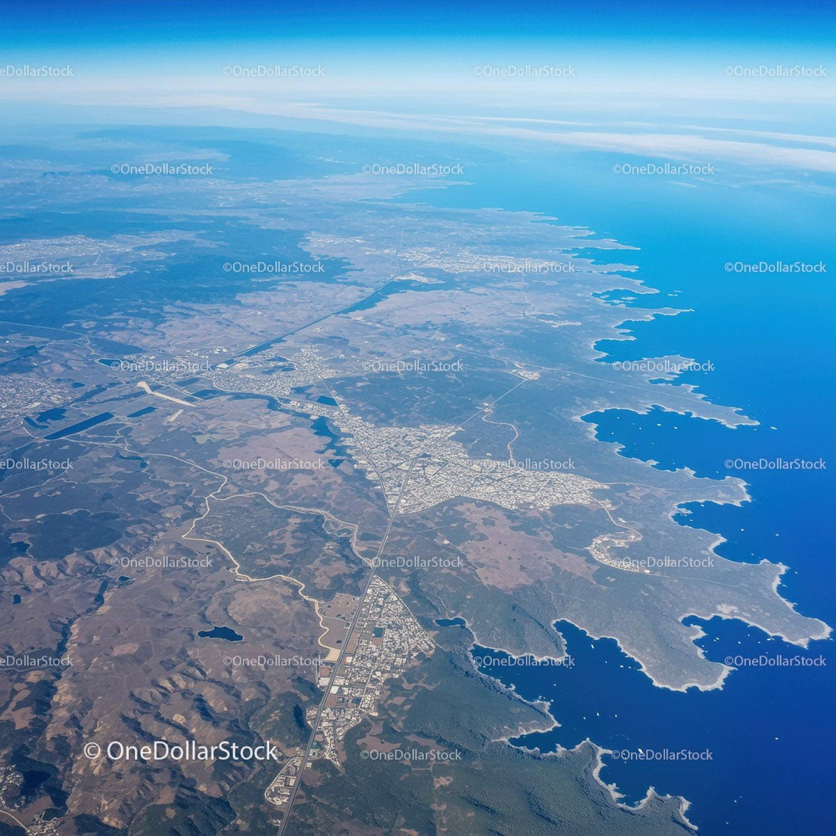 Stunning Aerial View of Rugged Blue Coastline with Islands and Beaches
