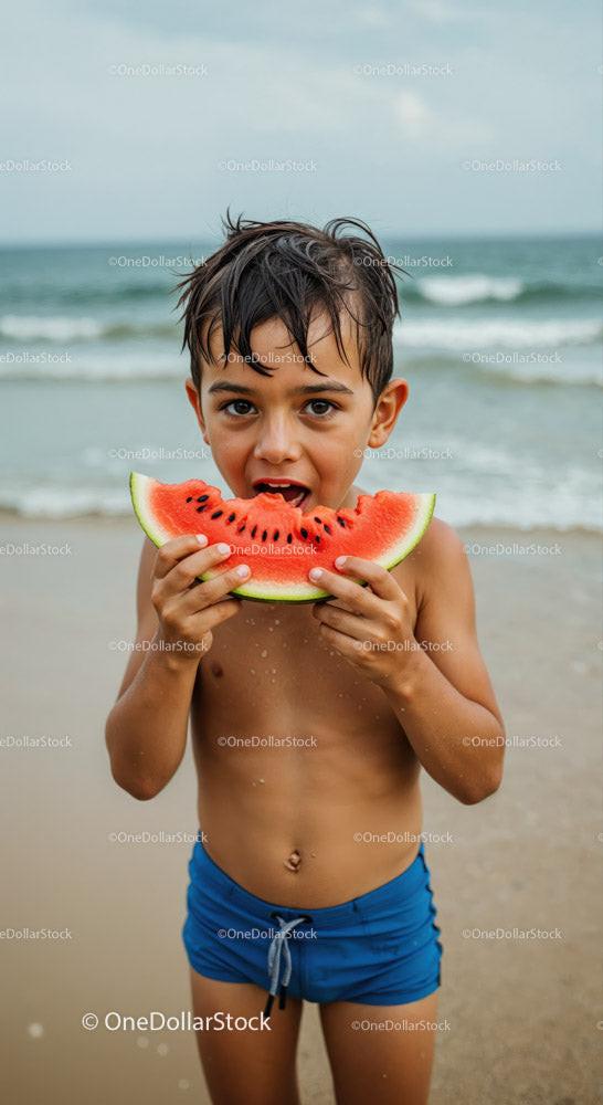 Boy Eating Watermelon on Beach During Summer Vacation