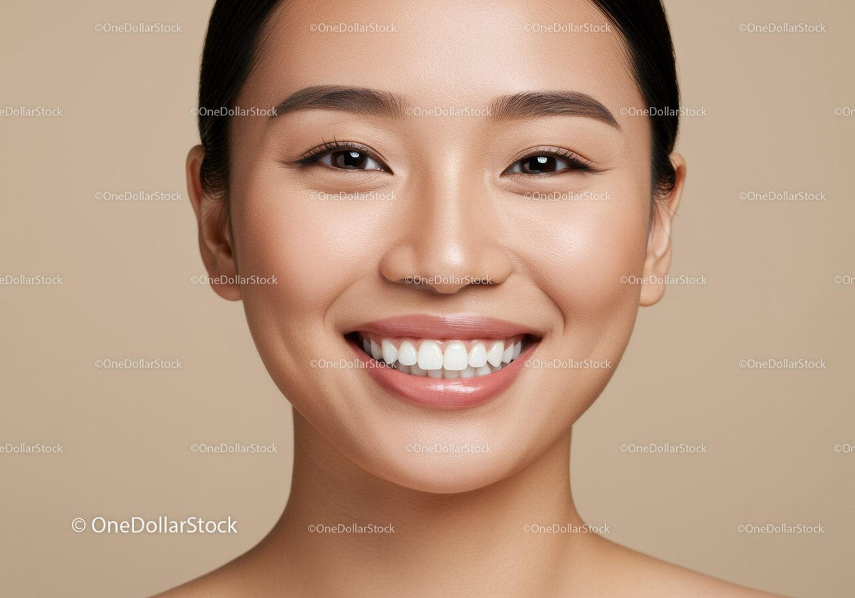 Close up of smiling young woman with flawless skin