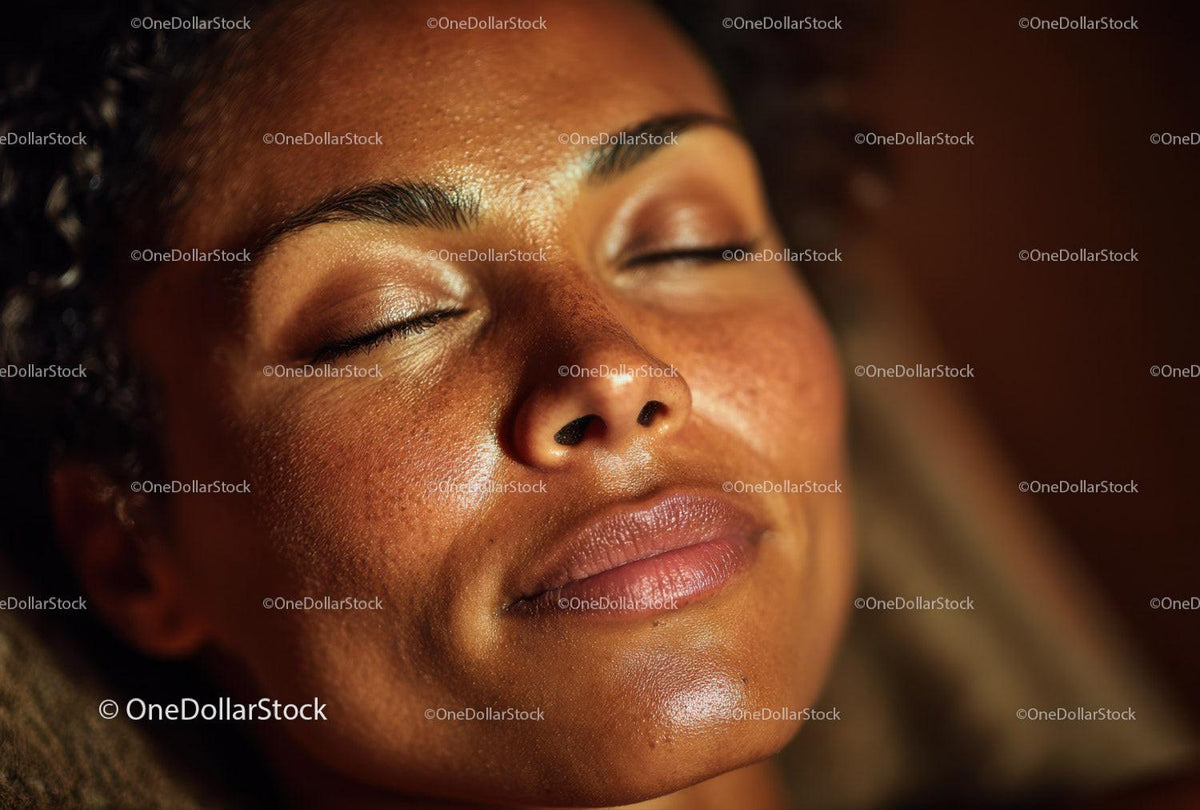 Close-up of a Relaxed African American Woman with Freckles and Closed Eyes