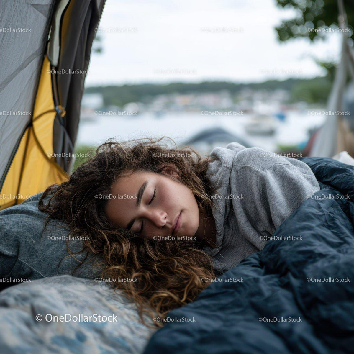 Peaceful Woman Sleeping in Camping Tent by the Waterfront