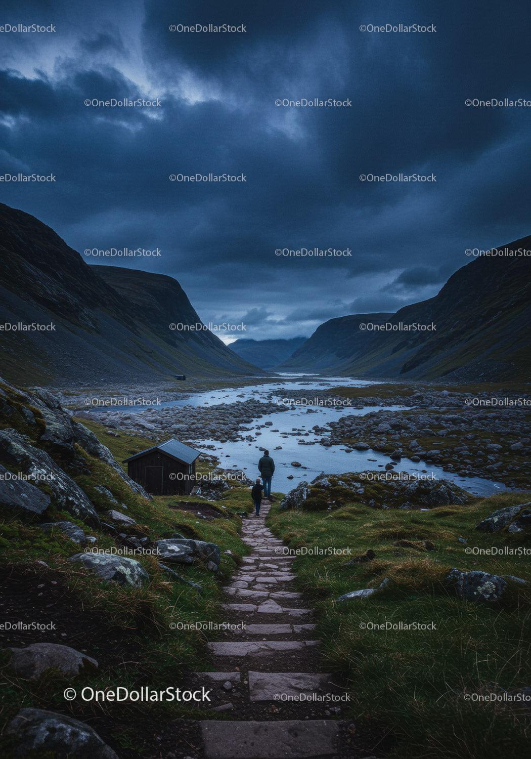 Two hikers walking on stone path by mountain river