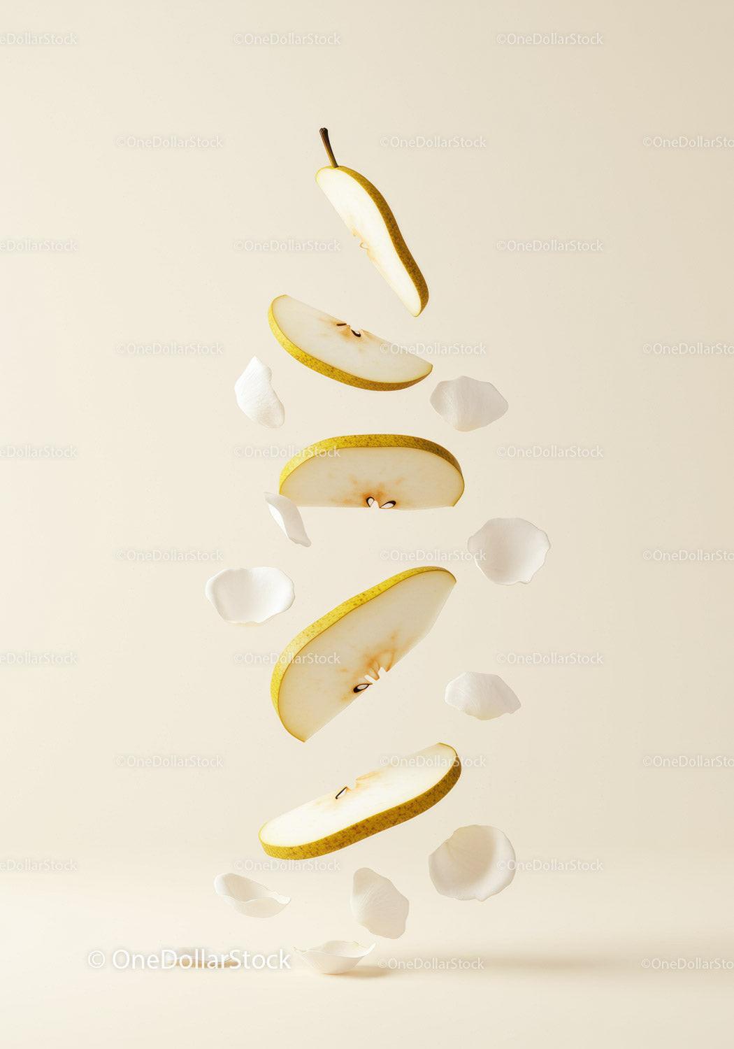 Floating Slices of Pear with Delicate White Petals