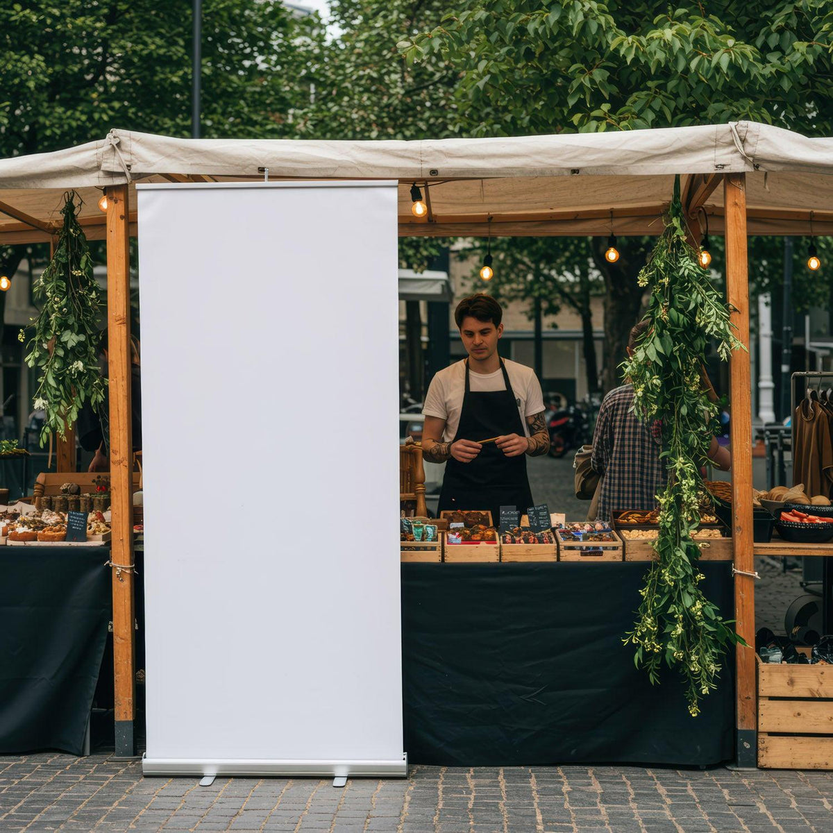 Young man selling pastries at outdoor market stall JPG Mockup Image preview