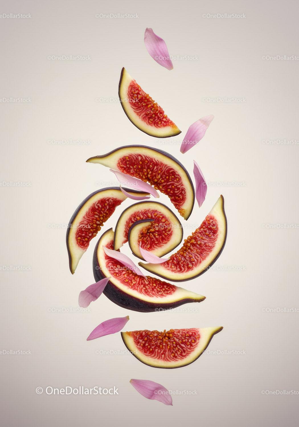 Fresh fig slices with delicate pink flower petals