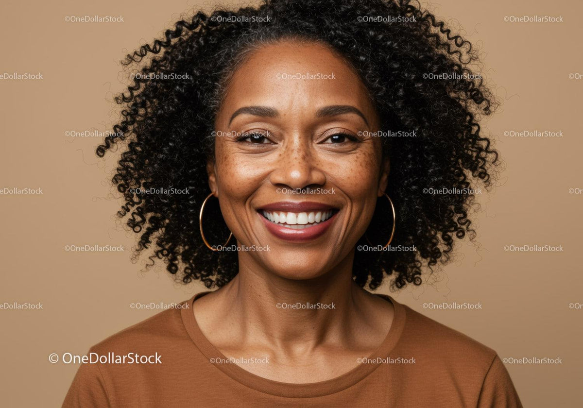 Portrait of a Smiling Woman with Curly Hair and Stylish Earrings