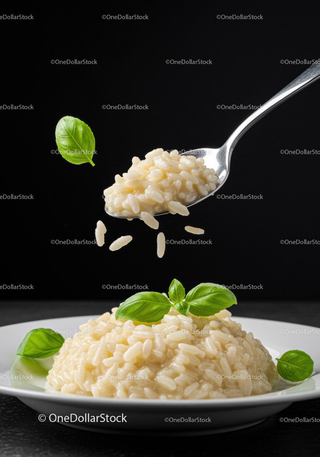 Creamy risotto with fresh basil leaves on white plate