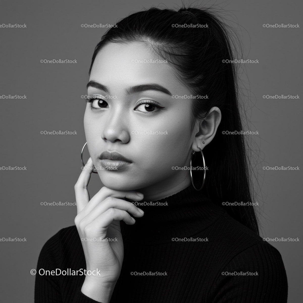Elegant Monochrome Portrait of a Confident Woman with Hoop Earrings