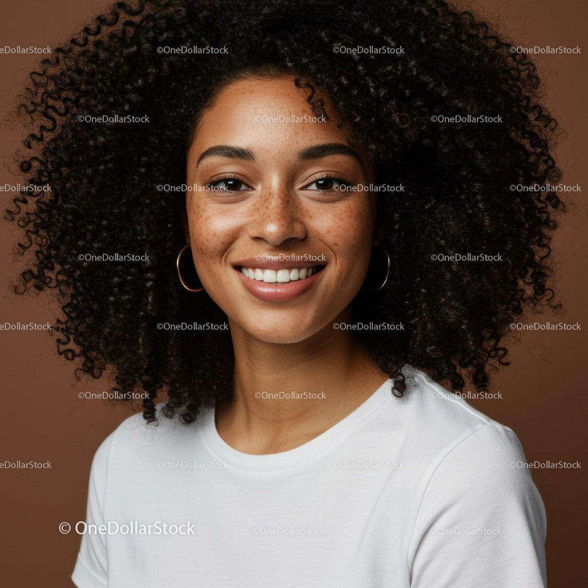 Joyful Woman with Curly Hair and Freckles in Casual White T-shirt