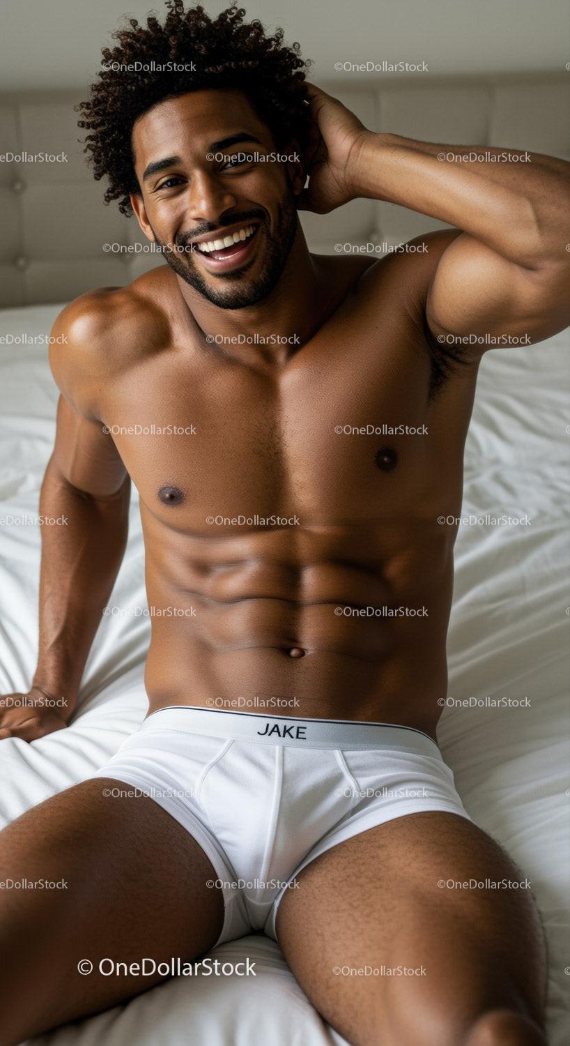 Smiling fit man relaxing on bed in white underwear