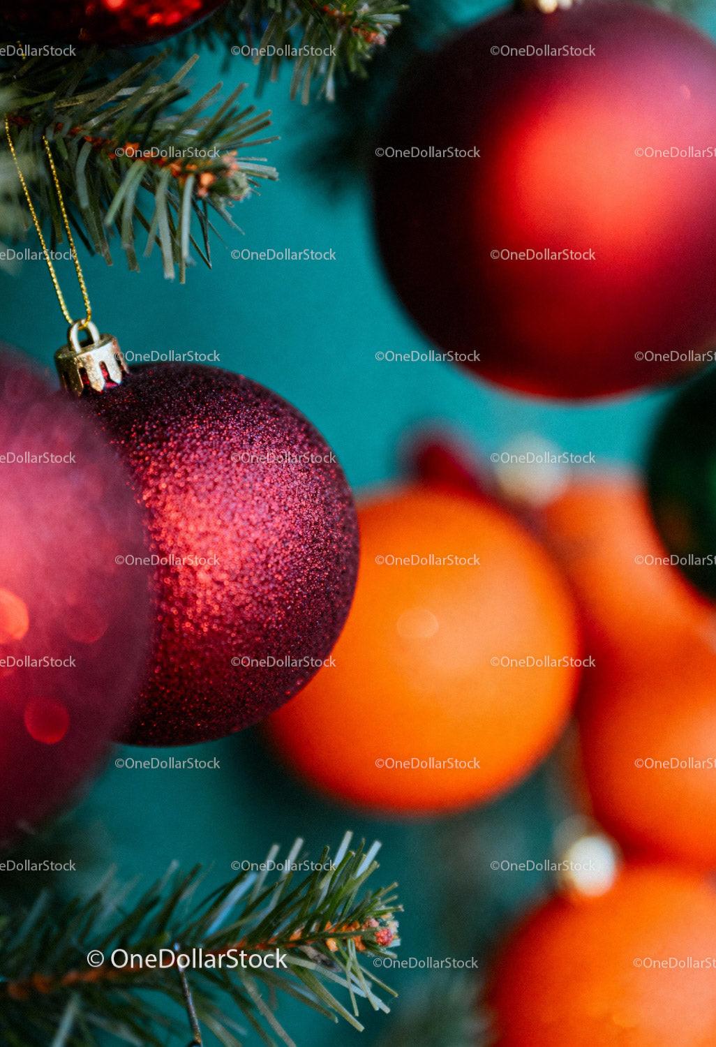 Close up of festive red and orange Christmas ornaments