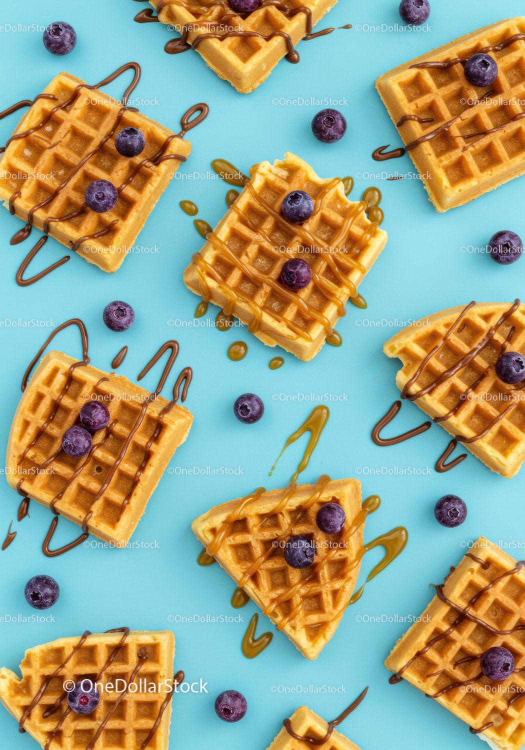 Delicious waffles with blueberries and drizzled syrup