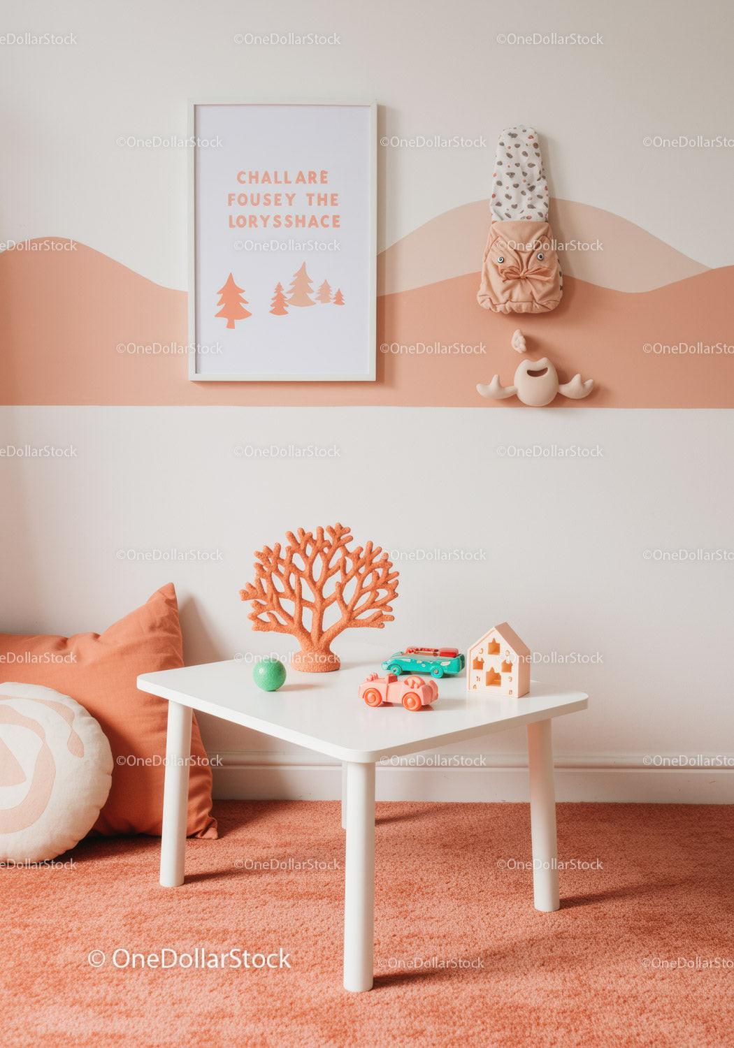 Cute Children's Room Decor with Wall Art and Toys in Pastel Pink and White