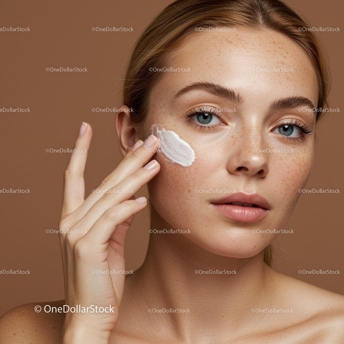 Close-up of a Woman Applying Moisturizer on Fair Skin with Freckles