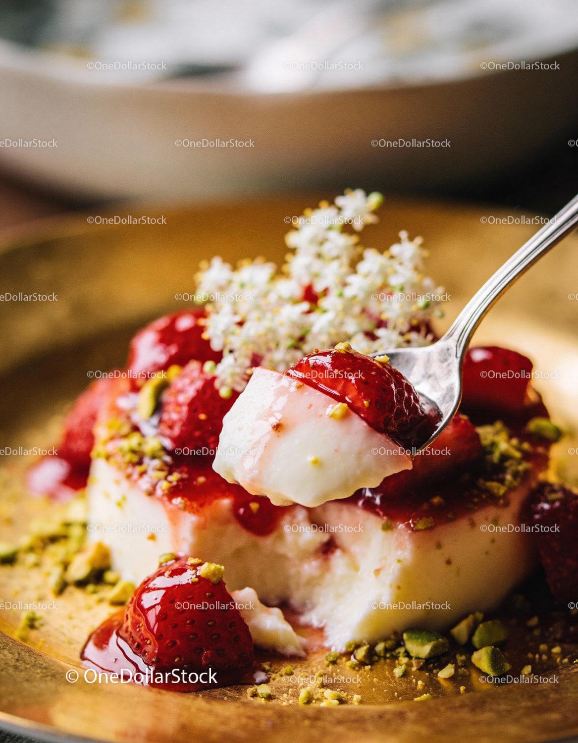 Creamy dessert with fresh strawberries and crushed pistachios