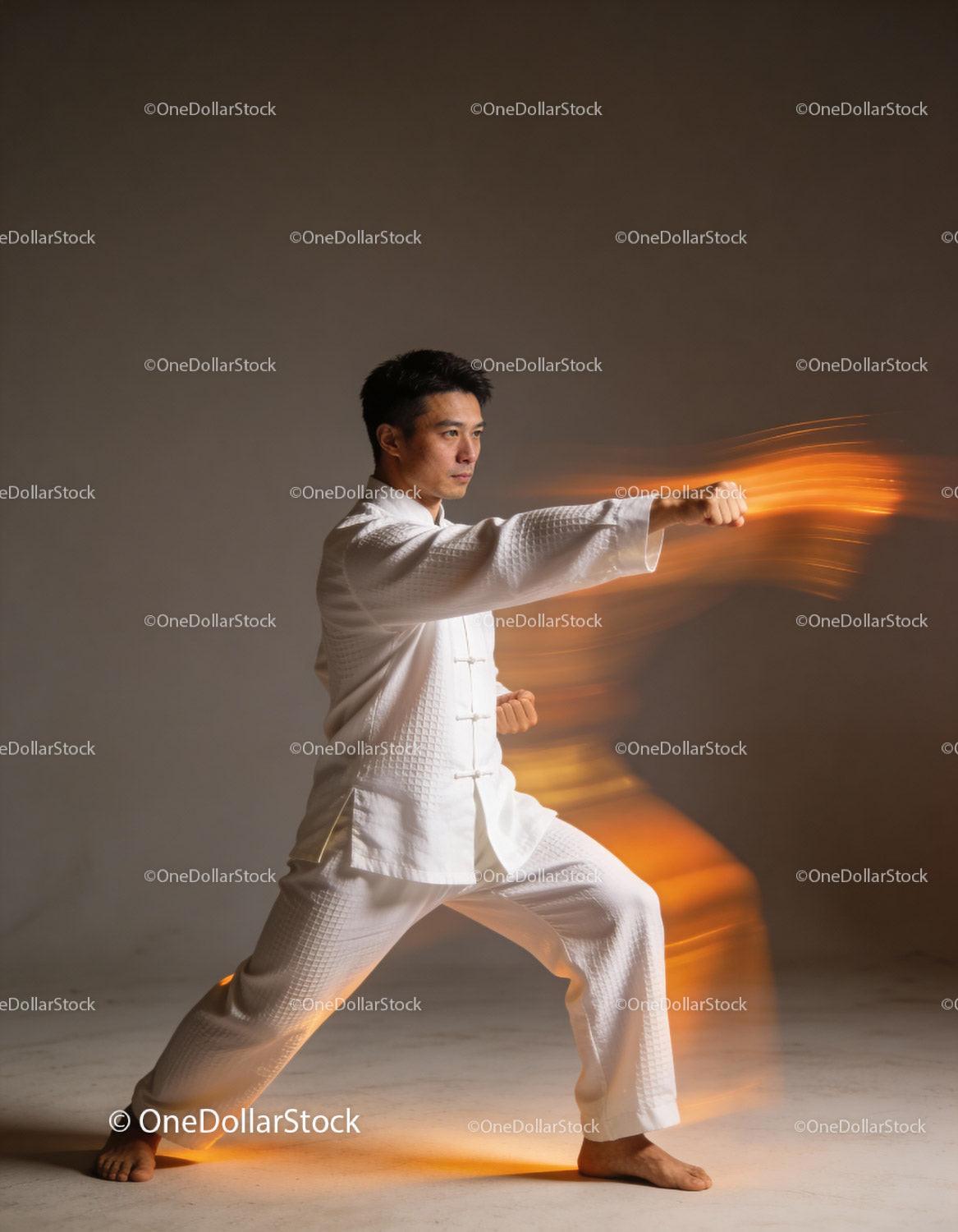 Man practicing martial arts punch in motion blur effect