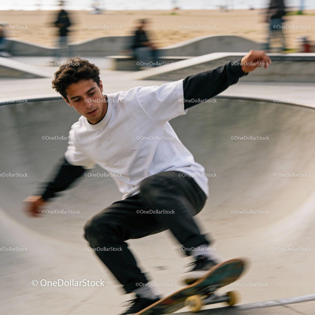 Young man performing a skateboard trick at skatepark