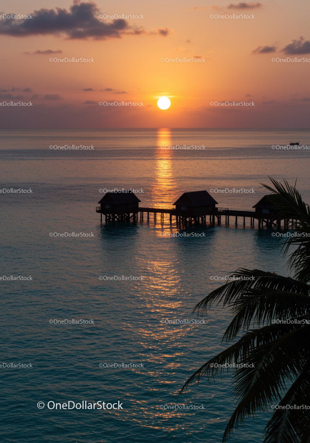 Beautiful Sunset Over Tropical Ocean With Overwater Bavilions and Reflection