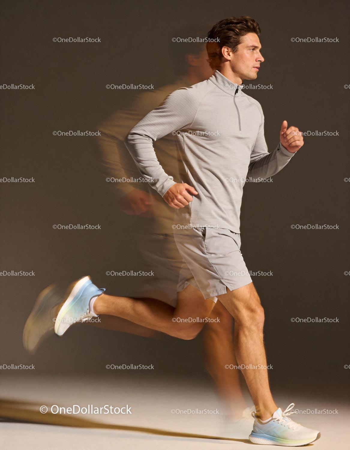 Athlete running indoors with focused expression