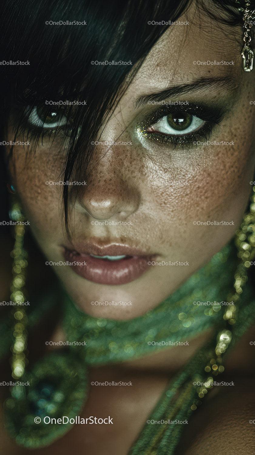 Close-up Portrait of a Woman with Green Eyes and Glittery Makeup