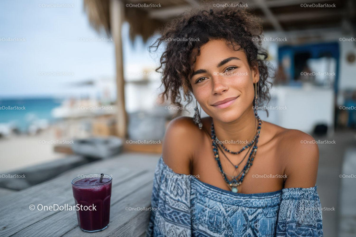 Young Woman Smiling at Beachside Cafe with Tropical Drink