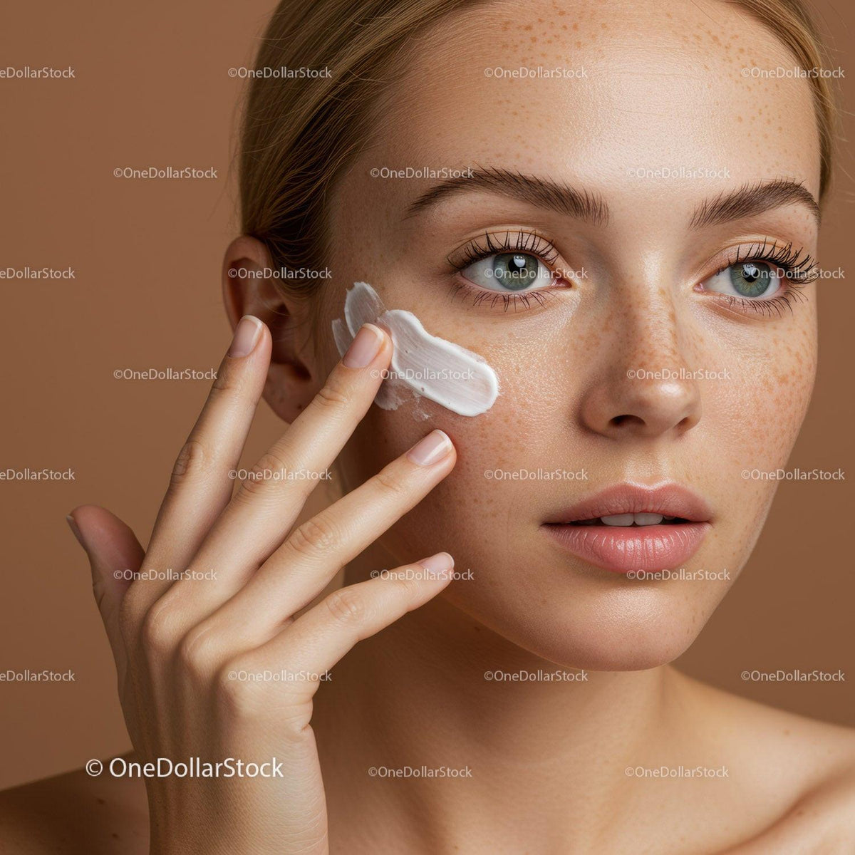 Close-up of a Woman Applying Facial Cream for Glowing Skin
